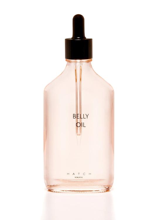 Pink belly oil in clear glass for pregnant women's stretch marks by Hatch