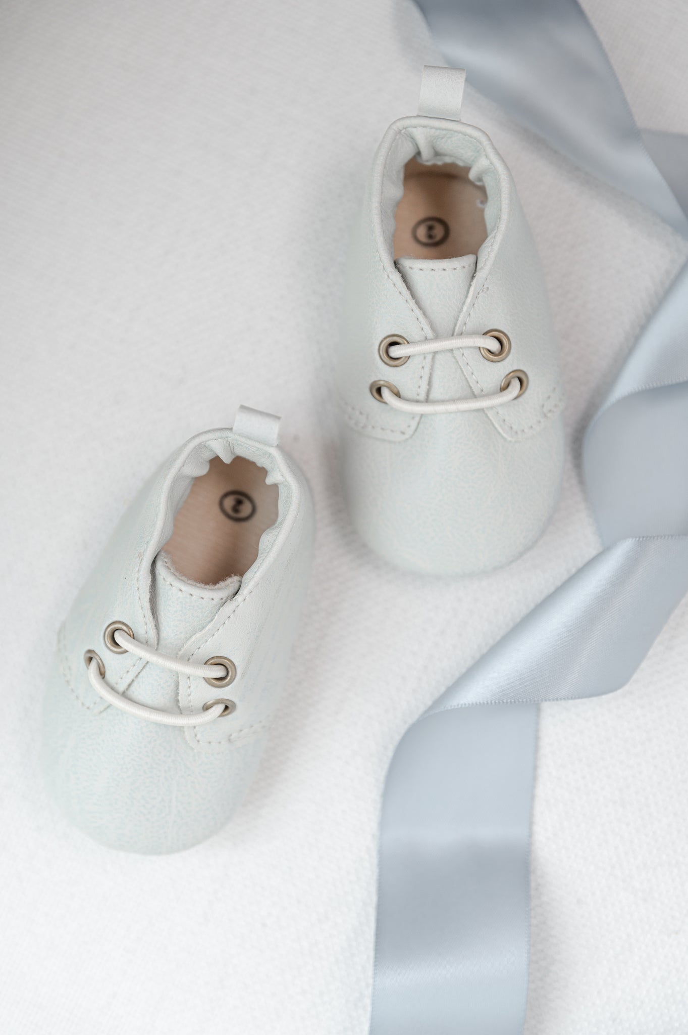 white baby moccasins