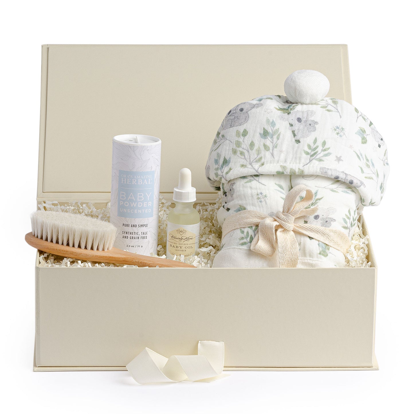 Baby bath gift set with a light blue koala print bath wrap, baby oil, organic baby powder and a wooden hair brush.
