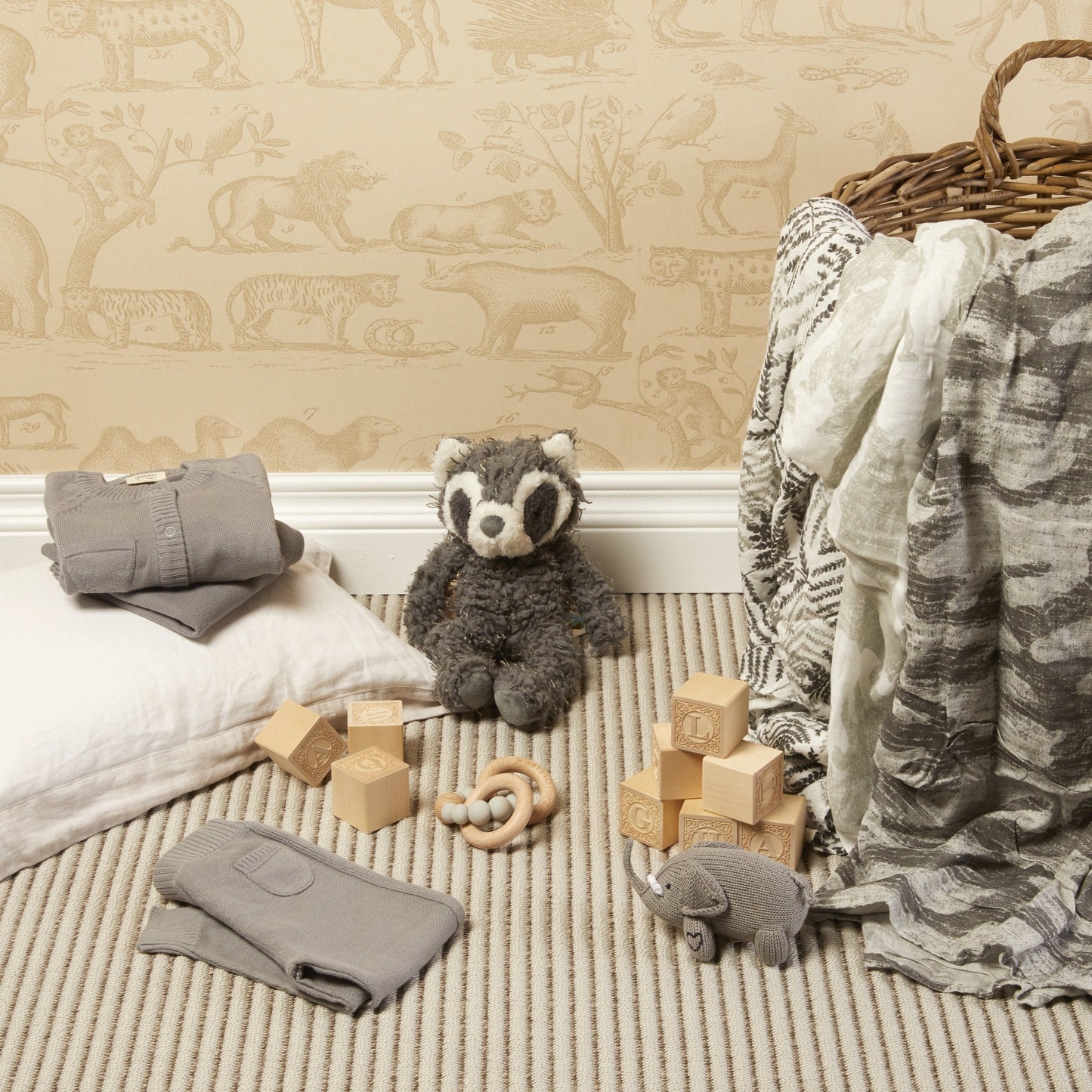 gift box content laid out in staged baby room